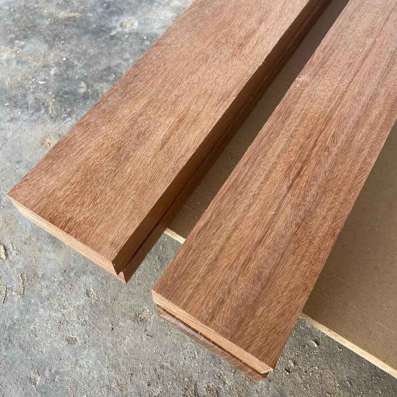 Two wooden planks on a textured surface