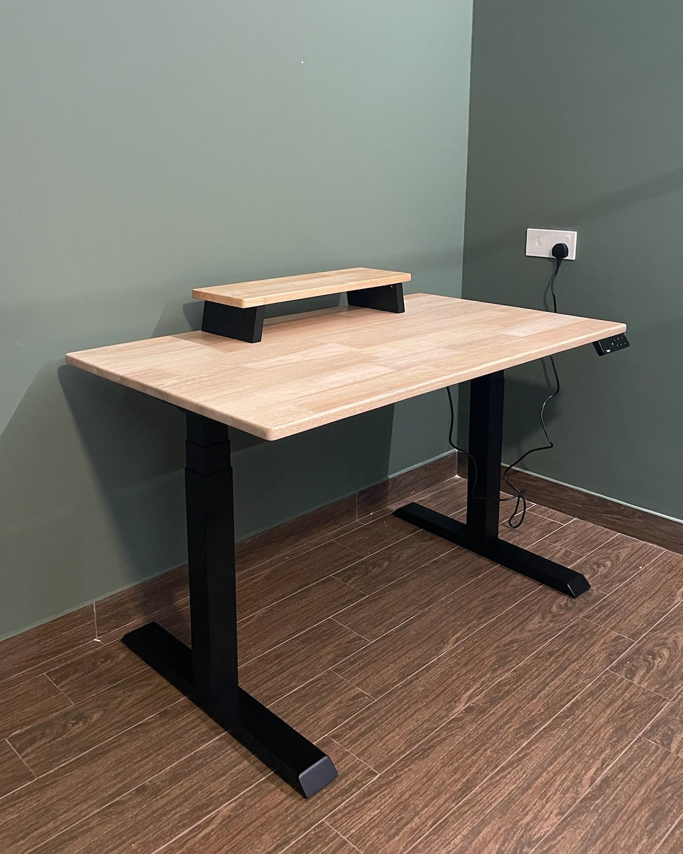 Standing desk with black legs with solid wood tabletop