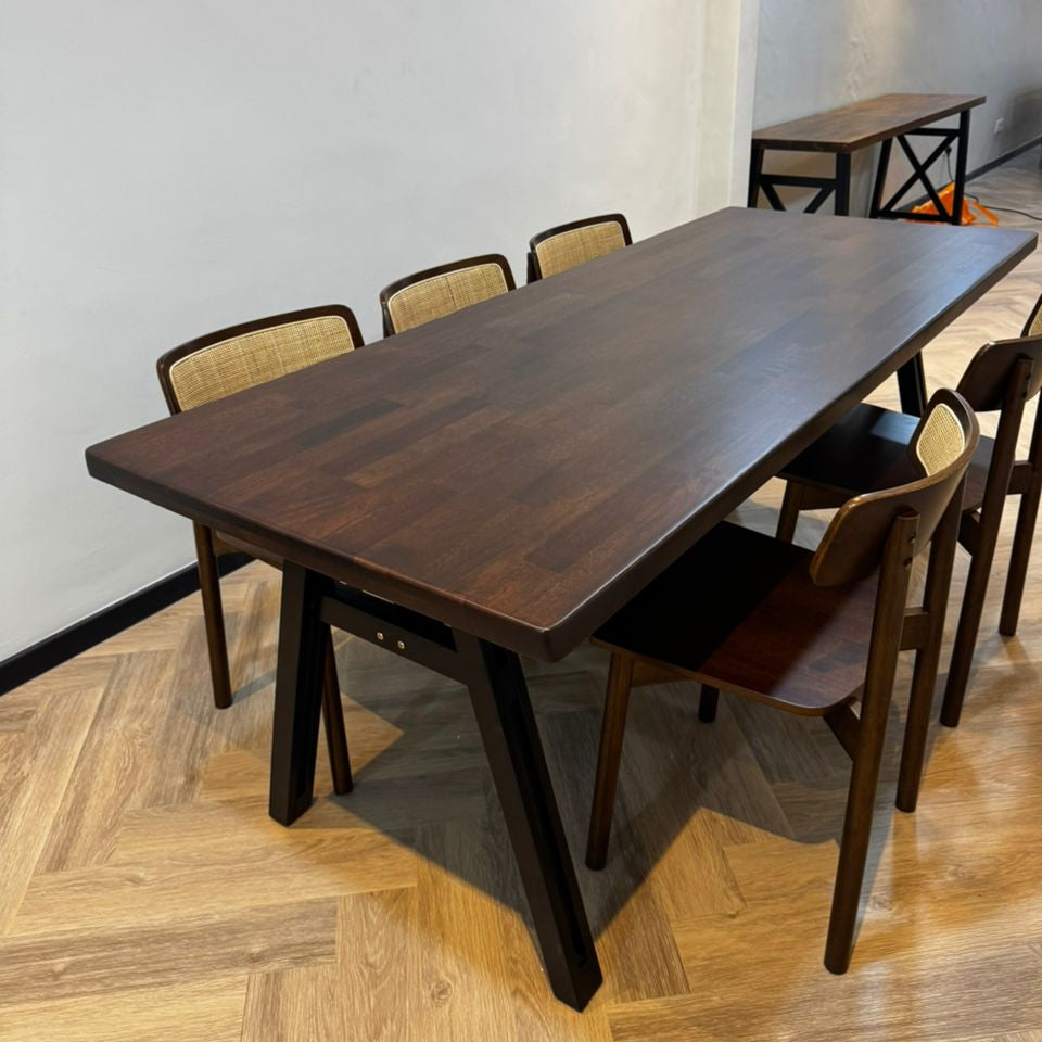 Dining table set with chairs on a wooden floor